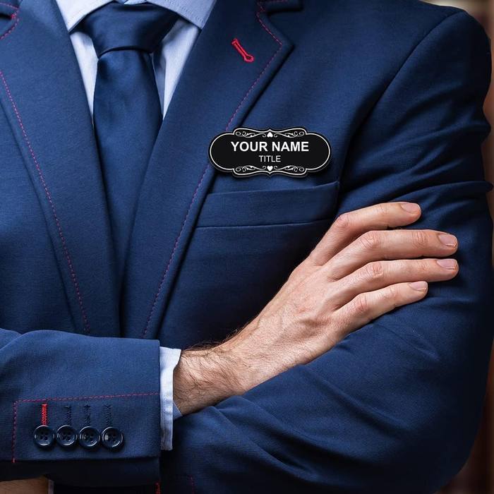 Hotel manager wearing a gold role badge